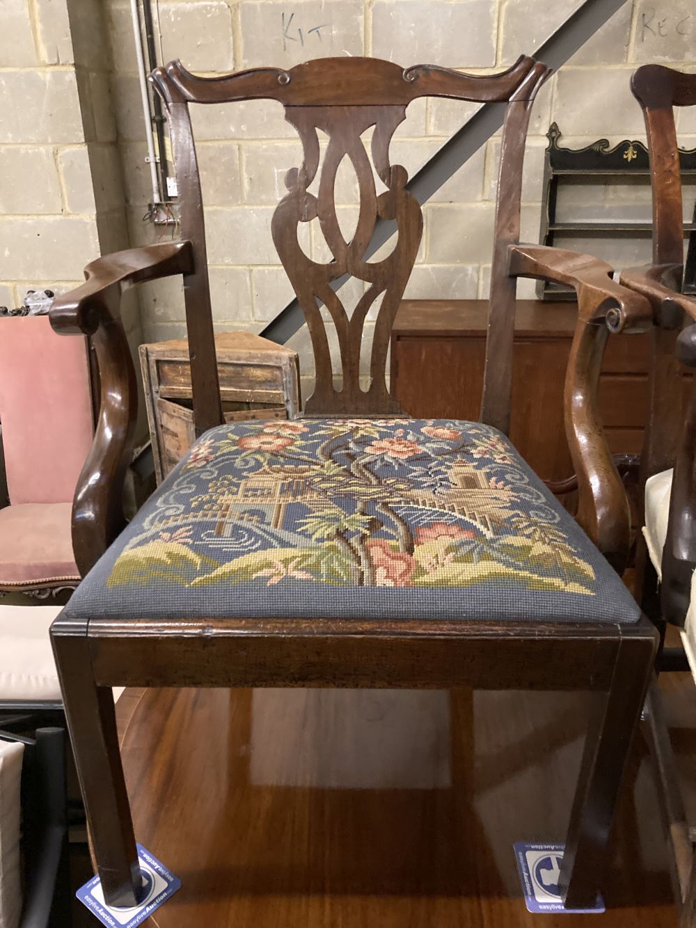 Two George III mahogany elbow chairs and a single chair